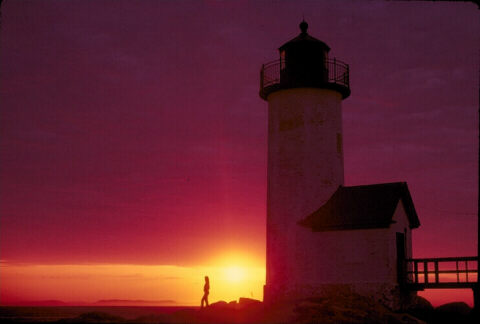 image of sunset by lighthouse